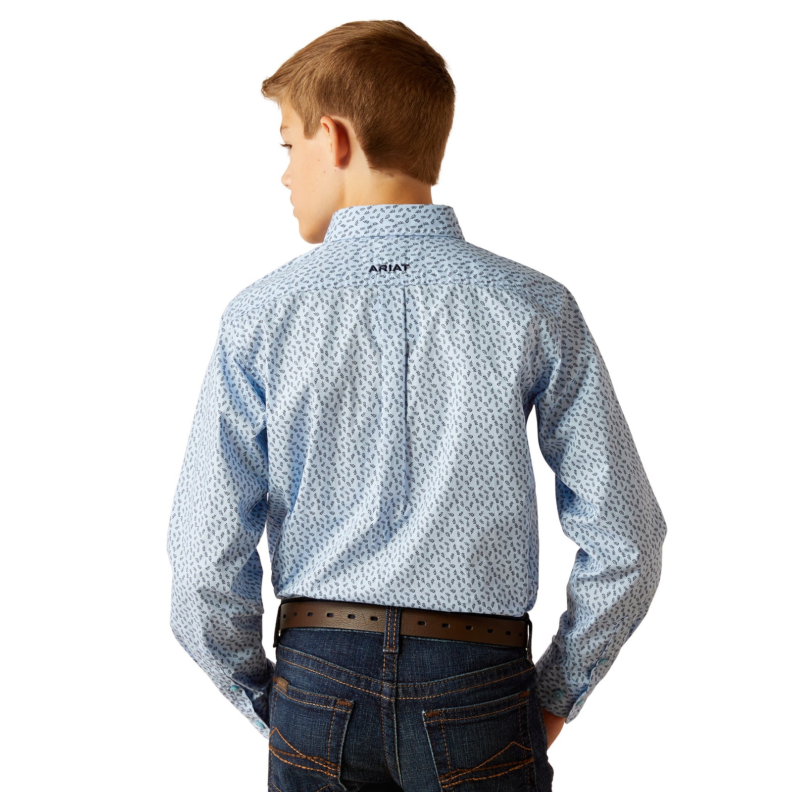 Ariat Boy's Rowan Classic Fit L/S Western Shirt. A boy wearing a long-sleeved blue and white geometric patterned Western shirt with a collar, button-up neck, and front button closure. He is also wearing blue jeans.