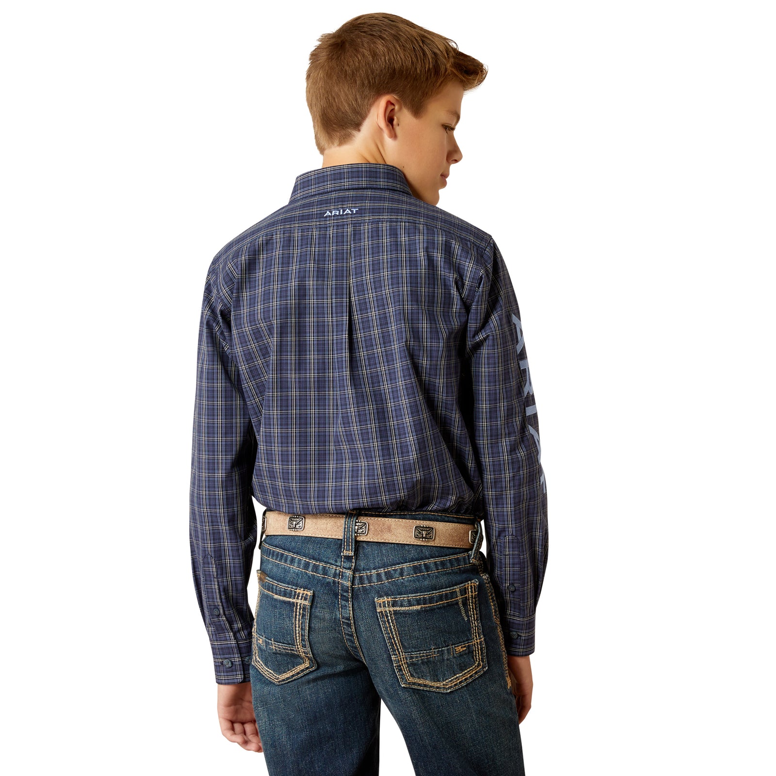 Ariat Boy's Pro Series Team Kolt L/S Western Shirt. A boy wearing a long-sleeved plaid Western shirt with buttoned collar points and sleeve embroidery.
