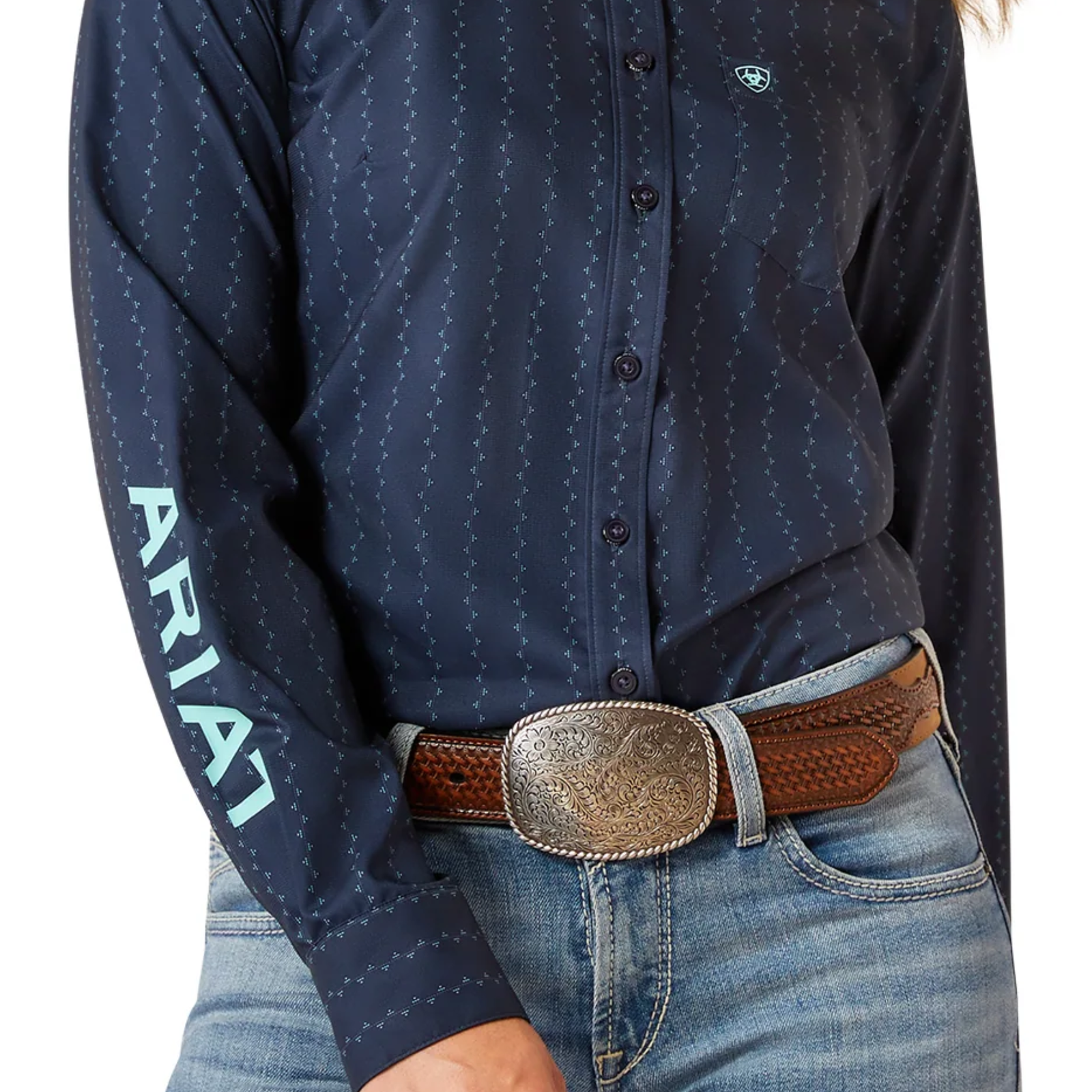 Navy blue button-up shirt with 'Ariat' branding, worn with jeans and a brown belt.