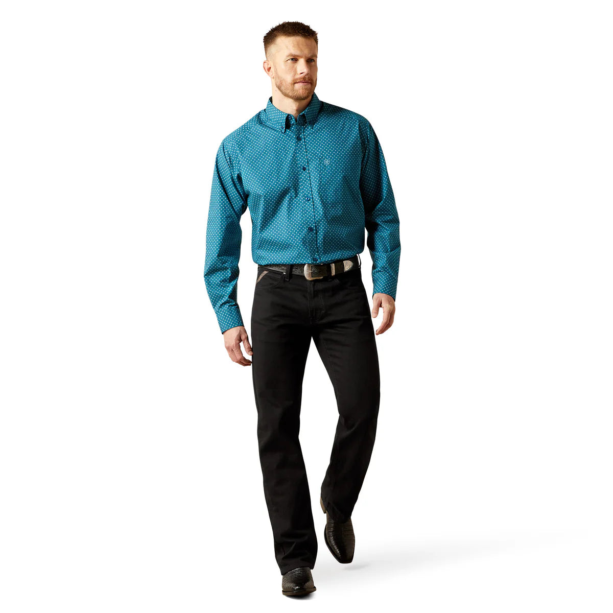 Man wearing a blue patterned shirt and black pants on a white background