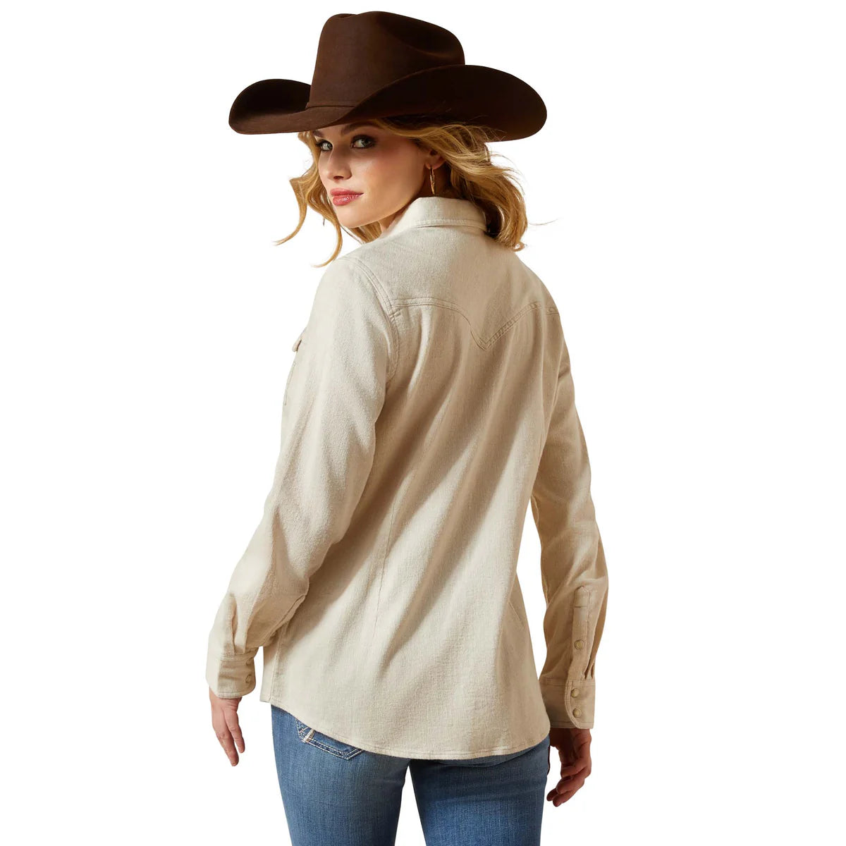 Woman wearing a beige shirt and brown cowboy hat on a white background