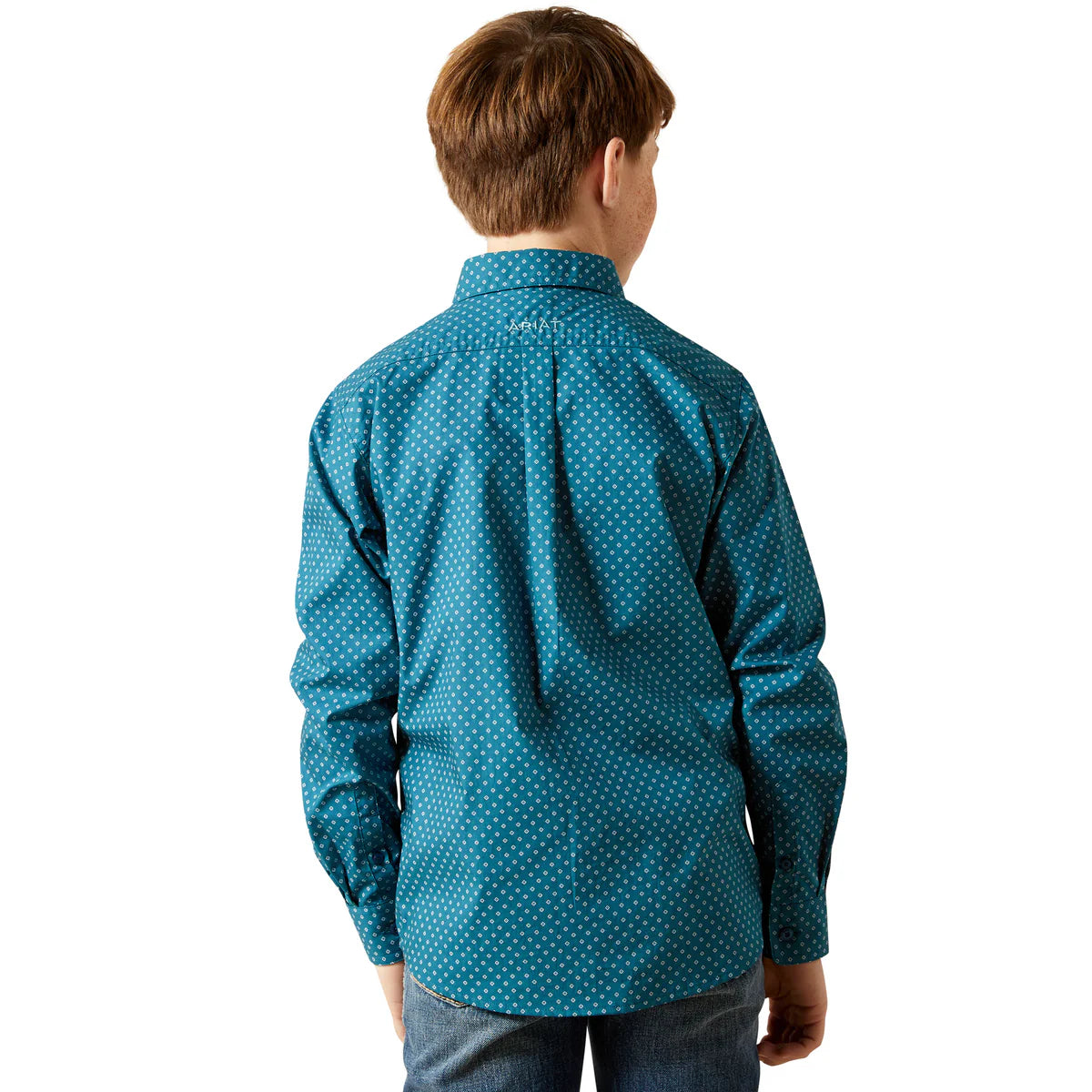 Child wearing a blue patterned shirt on a white background