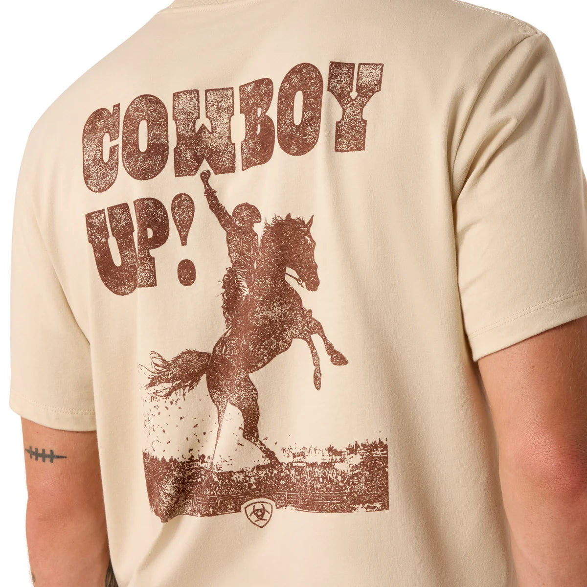 Beige t-shirt with 'Cowboy Up!' graphic and horse on a plain background