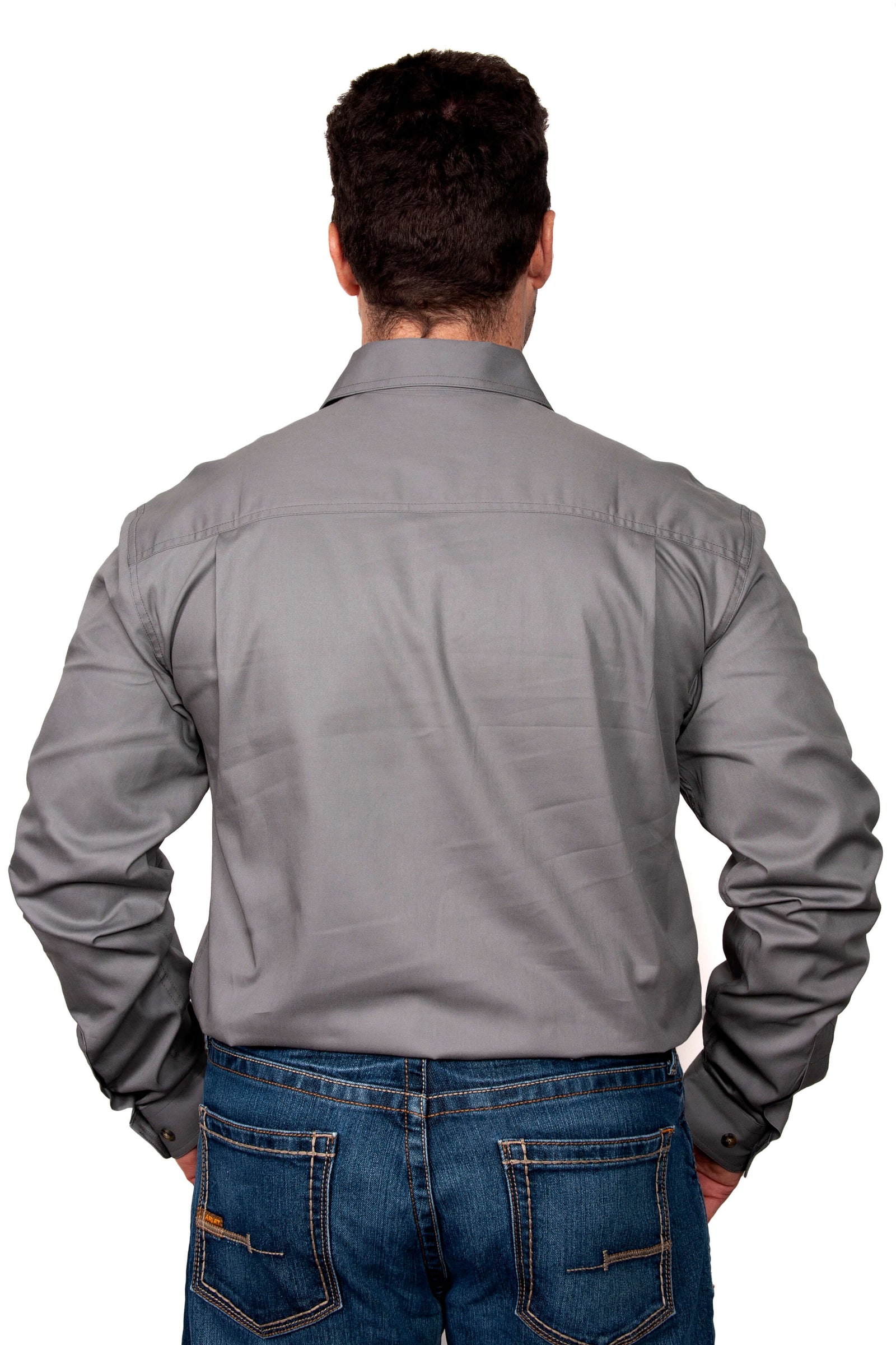 Just Country Men's Cameron L/S Workshirt. A man wearing a long-sleeved gray workshirt with double pockets and a collar.