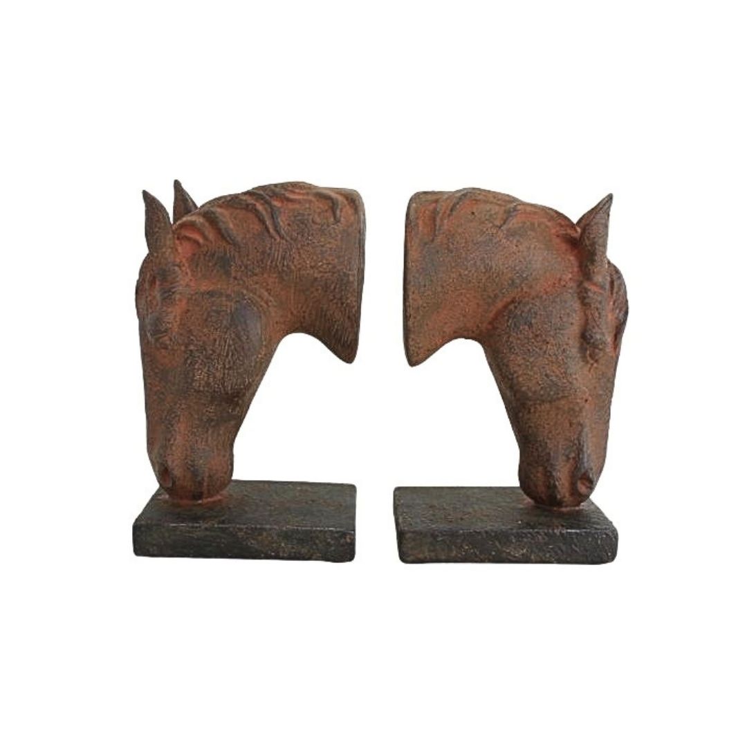 A pair of rustic cast iron horse head bookends on a plain white background.