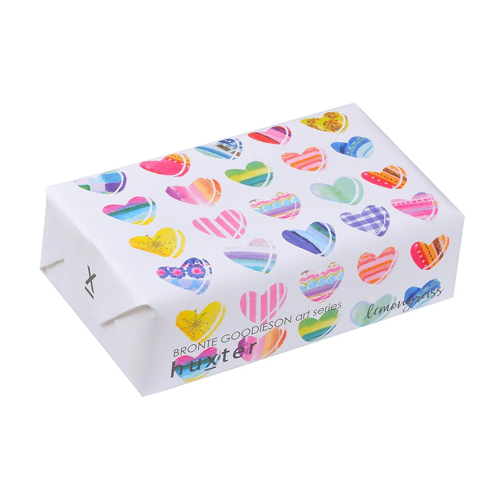 Huxter Hearts Mothers Day Soap. A packaged bar of Huxter soap with multicolored heart patterns on the wrapping, indicating it is a Mother's Day special edition.