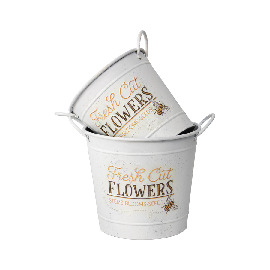 Fresh Cut Flowers Bucket Planters. Two white metal buckets with 'Fresh Cut Flowers' text and bee illustrations on a white background