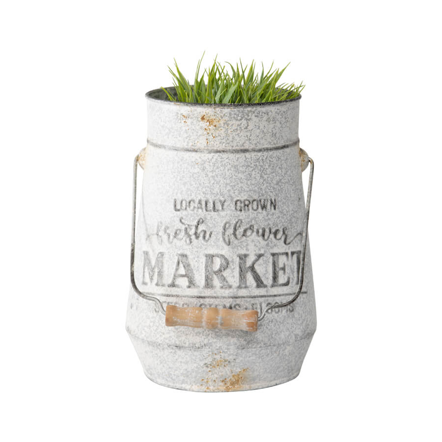 Flower Market Planter with Handle. Decorative metal planter with grass on a white background