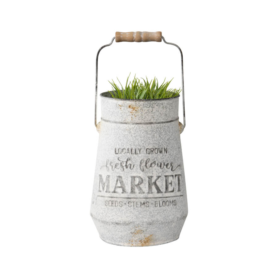 Flower Market Planter with Handle. Decorative metal container with grass on a white background