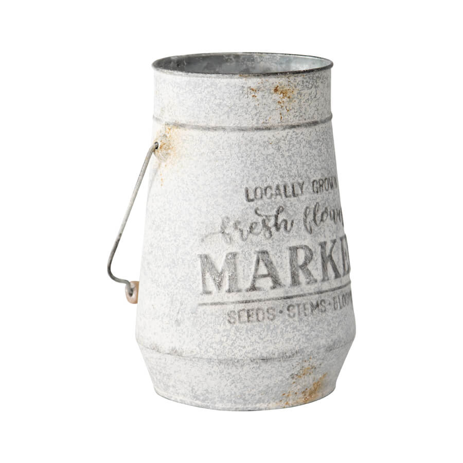 Flower Market Planter with Handle. Decorative metal container with grass on a white background