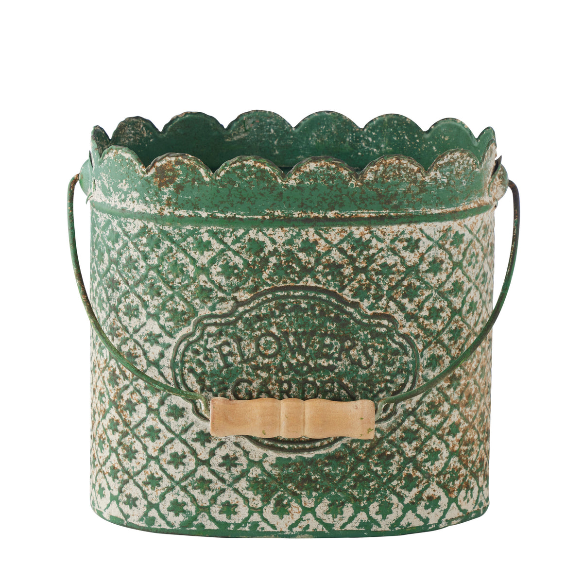 A distressed green metal bucket with a scalloped rim, embossed floral pattern, and a small wooden bow on the front, shown on a white background.