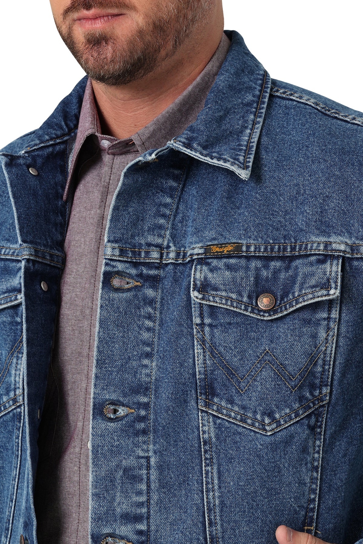 Wrangler Men's Classic Denim Jacket. Close-up of a person wearing a blue denim jacket with a brand logo.