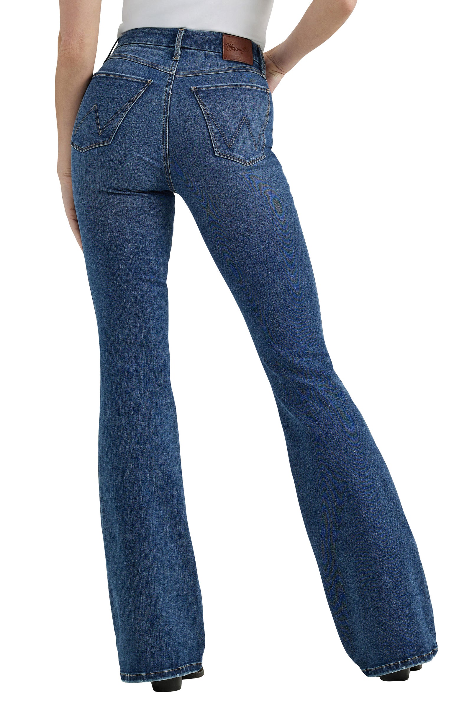 Wrangler Women's Bespoke High Rise Flare Jean. Blue jeans worn by a person on a white background