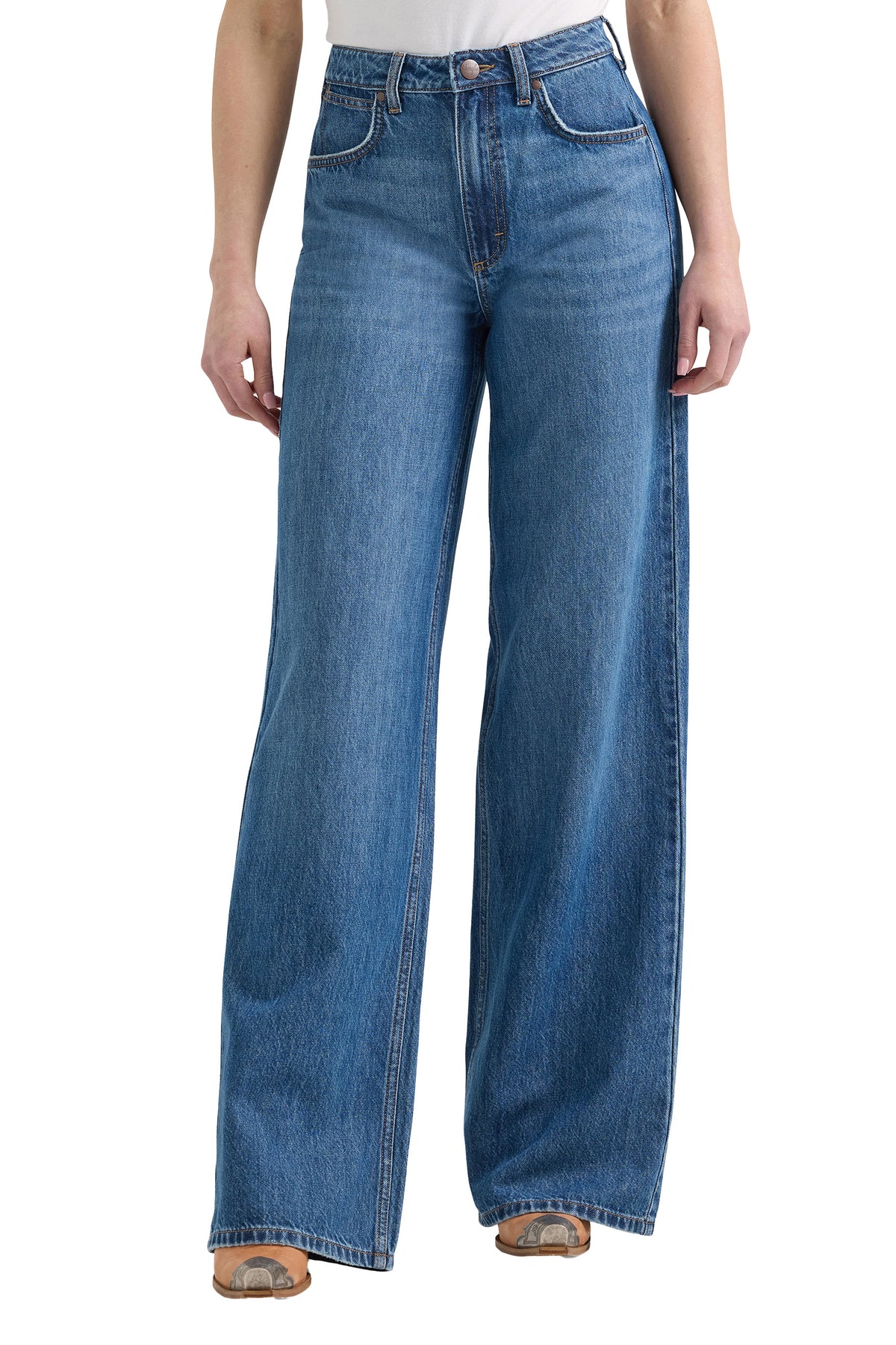 Blue jeans worn by a person on a white background