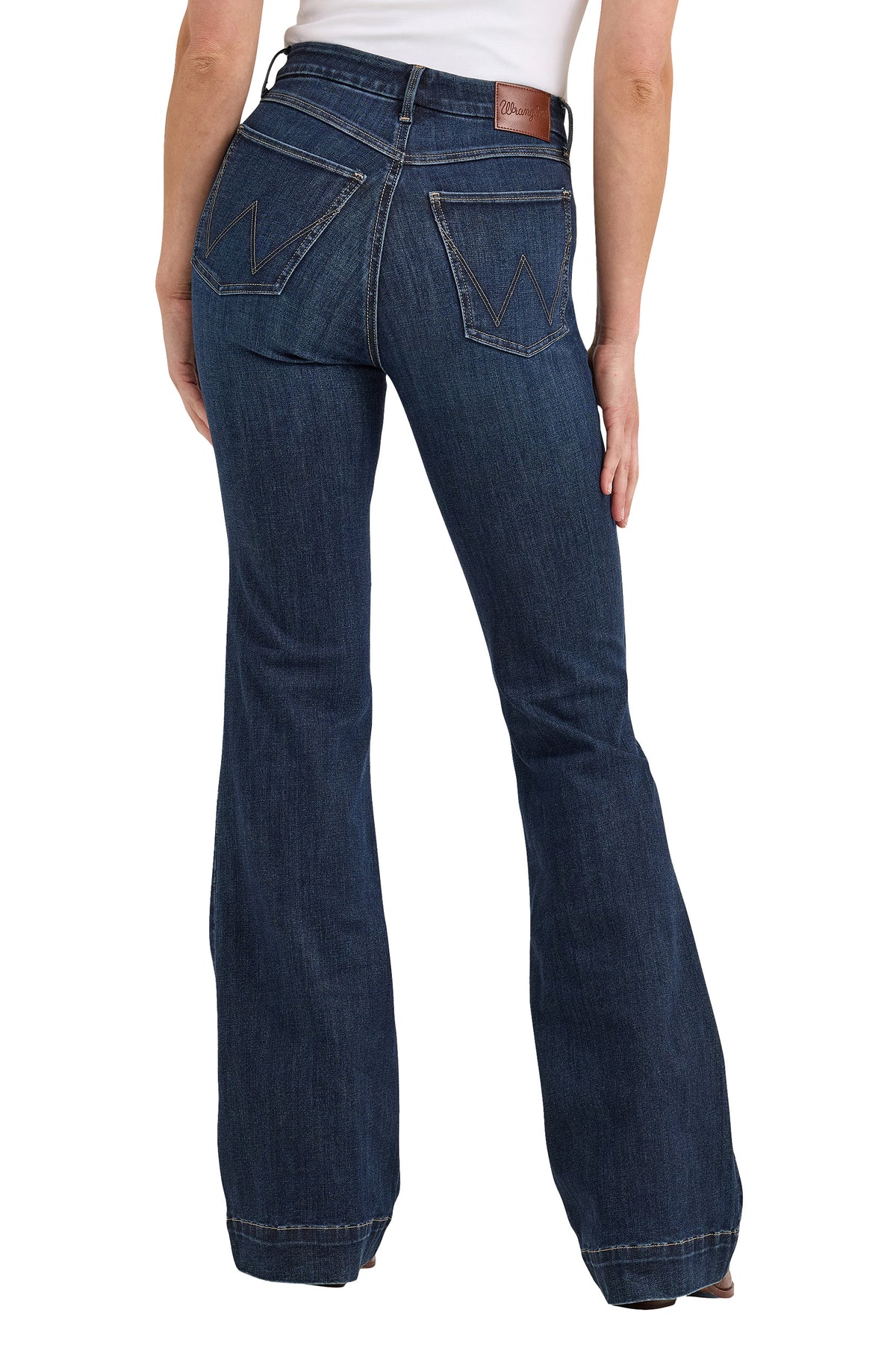 Wrangler Women's Bespoke High Rise Trouser. Dark blue flared jeans worn by a person on a white background