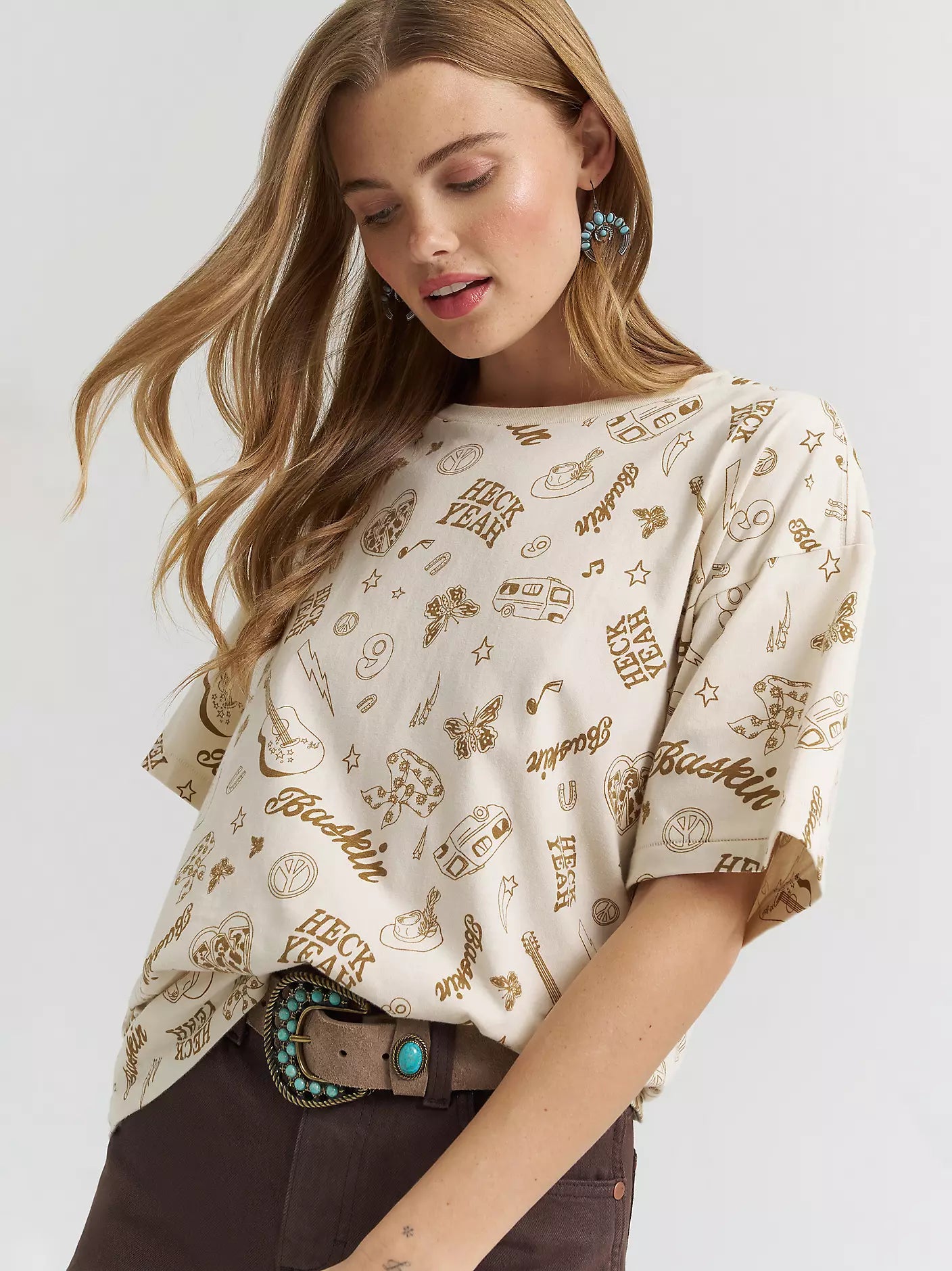 Woman wearing a patterned blouse with a neutral background