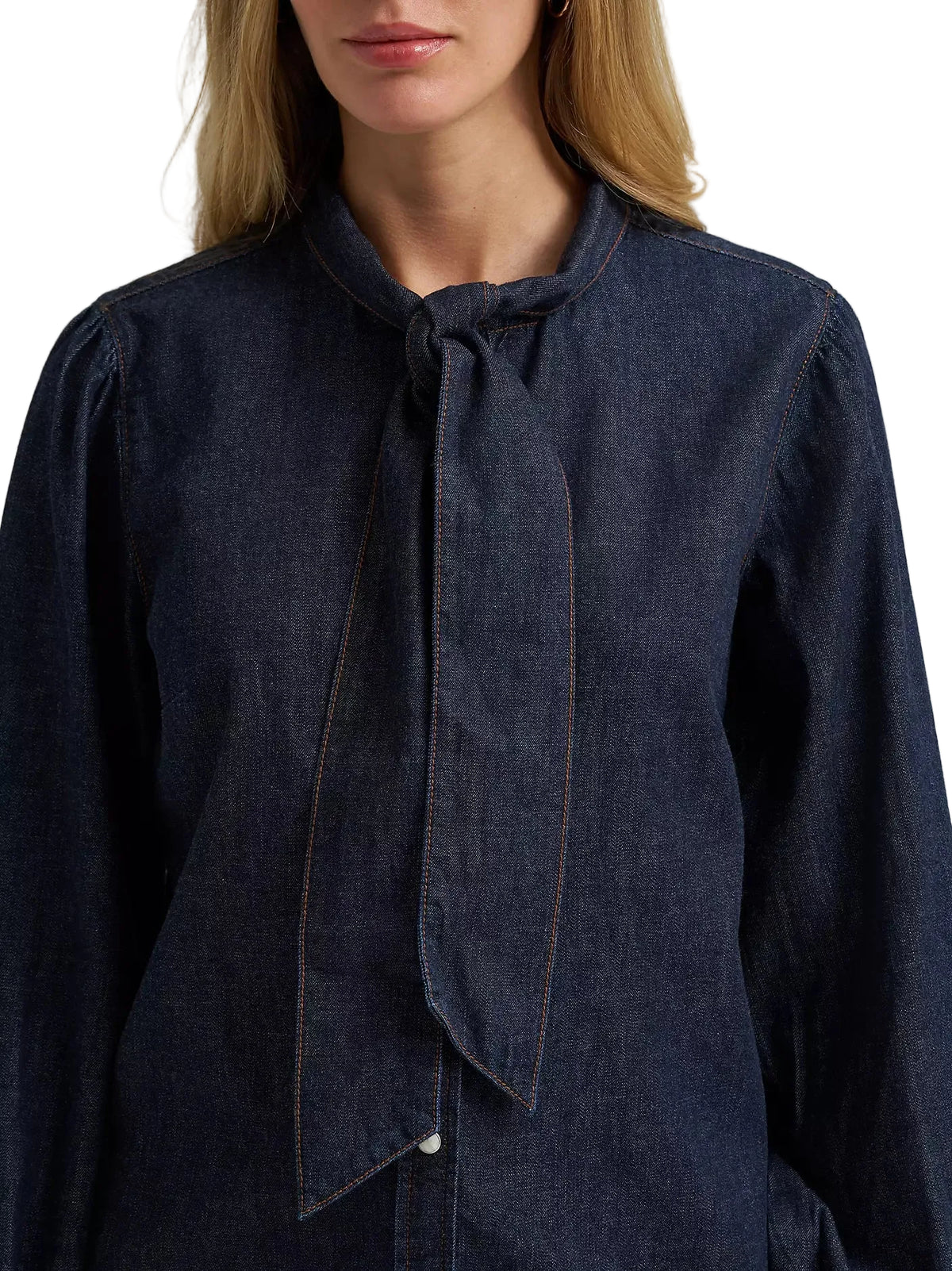 Navy blue blouse with a tie neckline on a plain background