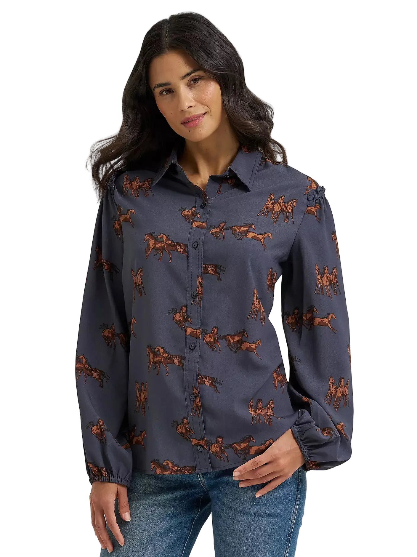 Woman wearing a navy blue shirt with horse pattern on a gray background