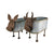 Nested Cow Planters Set of 2. Two decorative planters shaped like cows with flowers on a white background