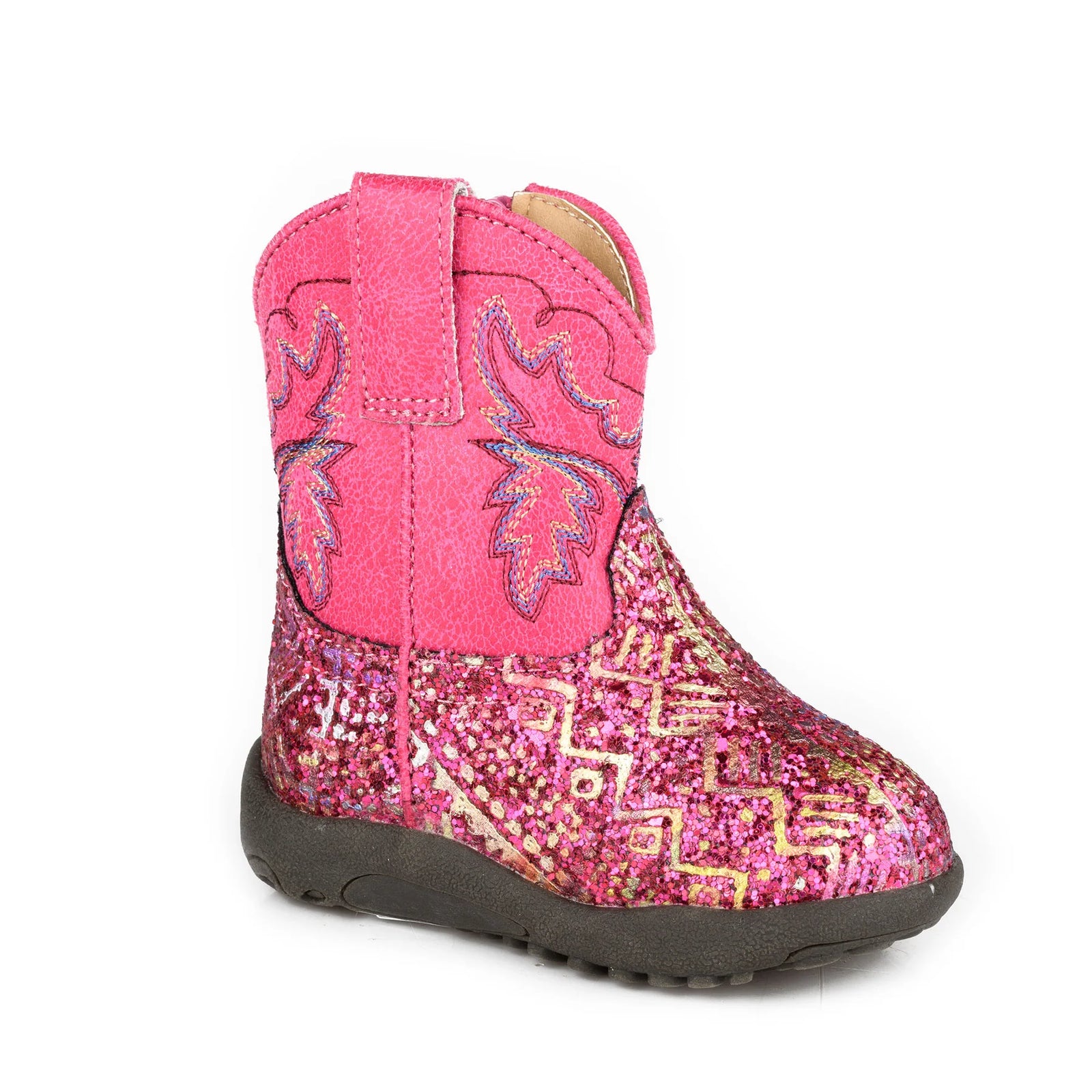 Pink glittery cowboy boot with decorative patterns on a white background