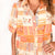 Women's Freedom Flame "Ellie" Dress. 
Woman wearing a patterned dress on a white background