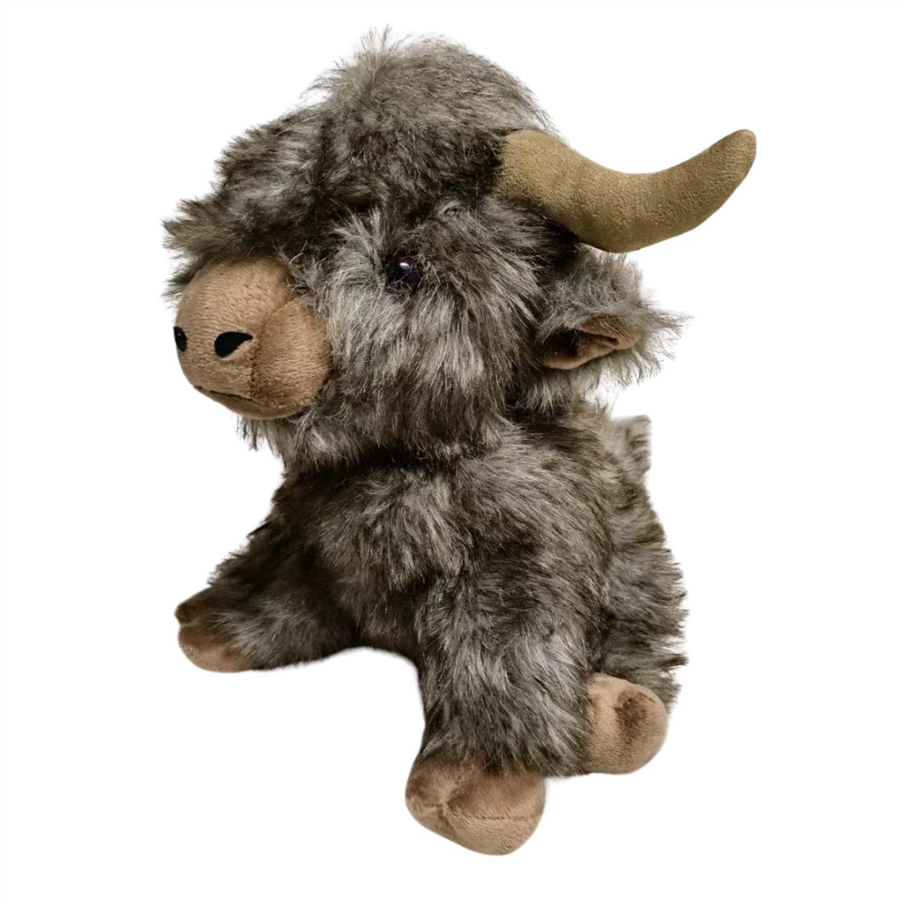 A plush stuffed animal shaped like a shaggy Highland cow or yoke, with gray and brown faux fur, tan muzzle and horns, and small black eyes, photographed on a plain white background.