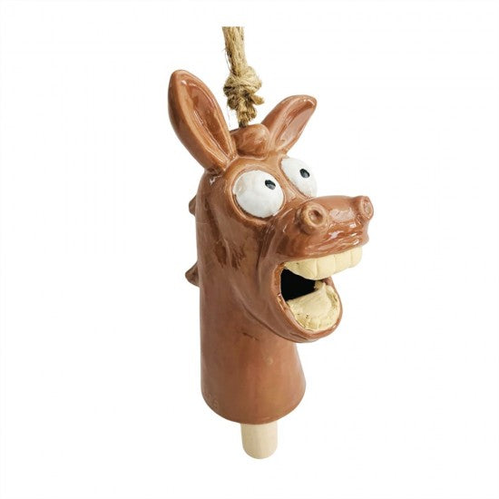 A ceramic donkey bird feeder with a brown glazed body, white eyes, and an open mouth showing wooden teeth, hanging from a natural jute rope on a white background.