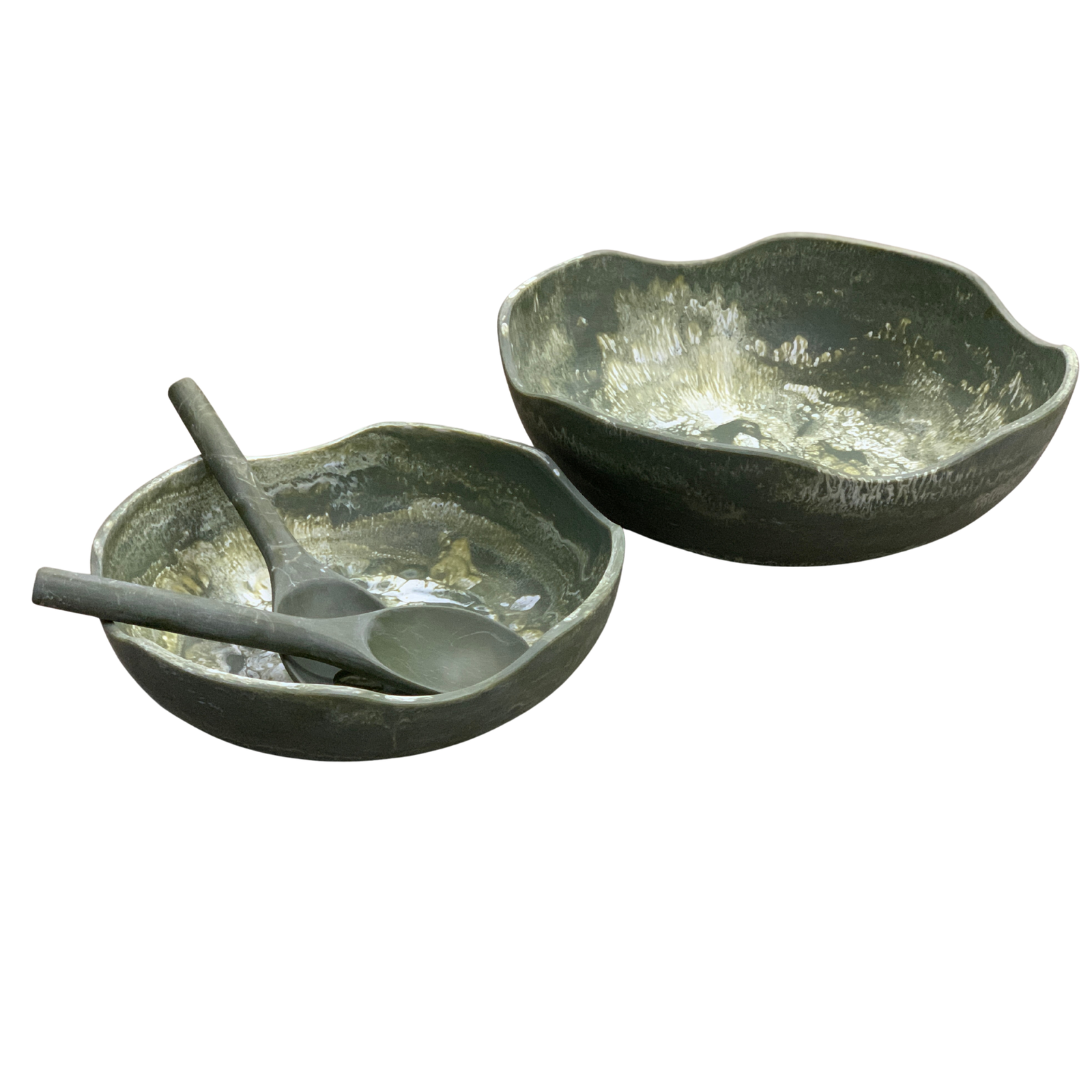 Two rustic stone bowls with a wooden spoon on a white background