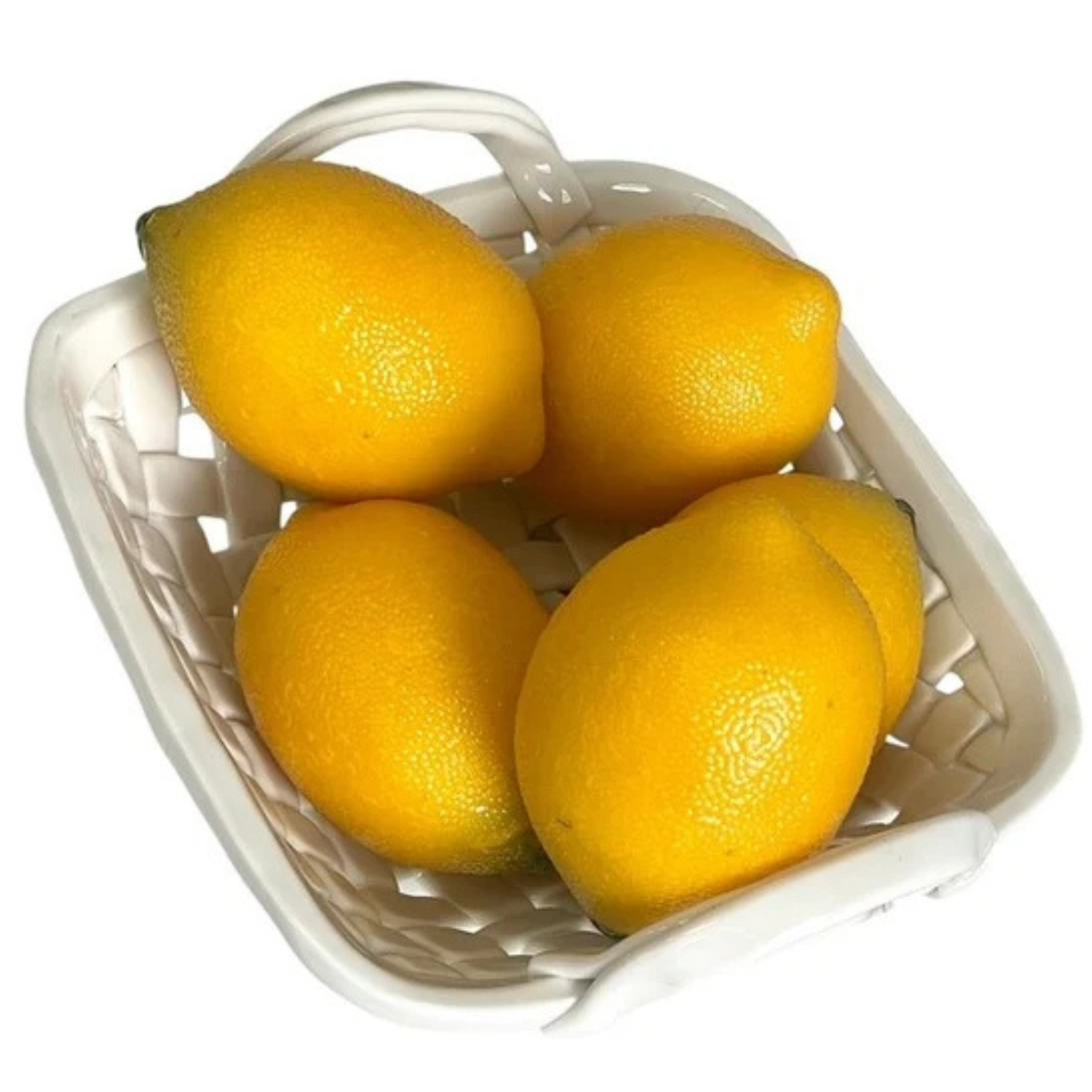 Five bright yellow lemons arranged inside a small white woven basket on a plain white background.