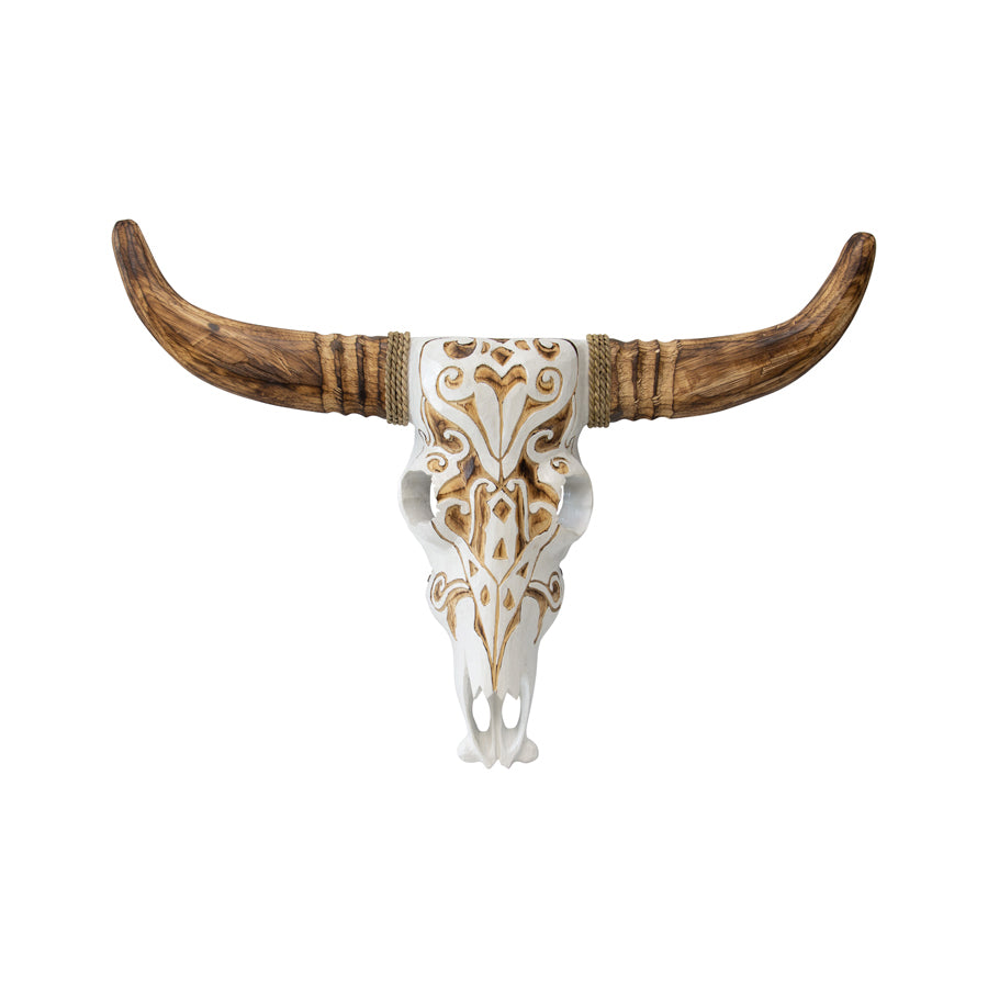 Hand Carved Animal Head Wallart. Decorative bull skull with wooden horns on a white background