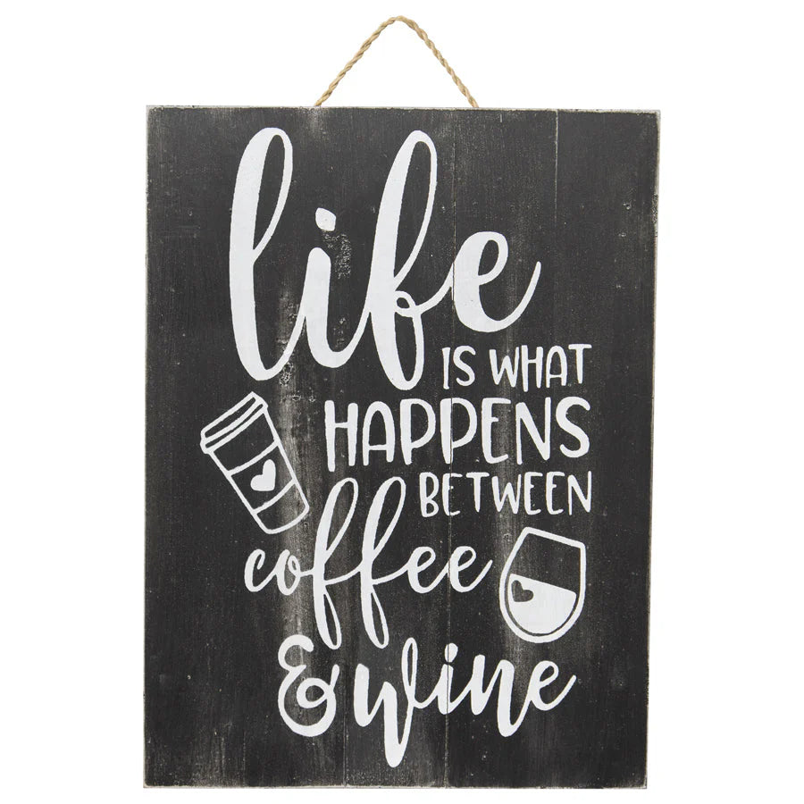 Handcrafted Life Coffee & Wine Wall Art. Wooden sign with 'life is what happens between coffee & wine' text on a black background