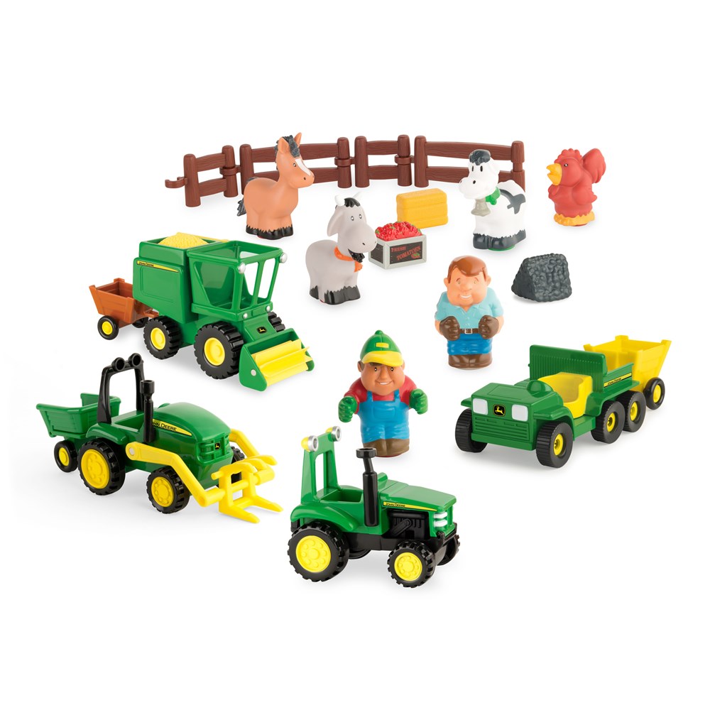 Toy farm set with tractors, trucks, and farm animals on a white background