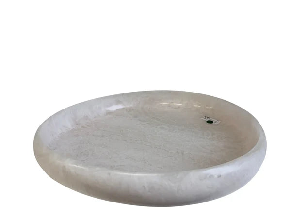 Round stone sink on a white background