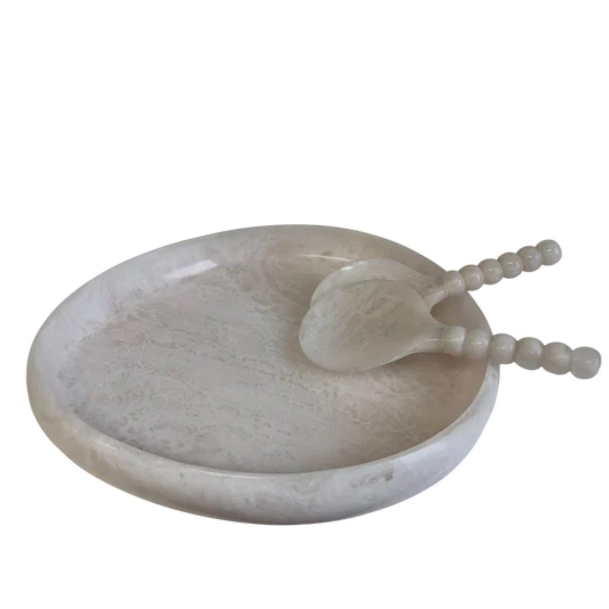 A round white marble tray with a matching marble spoon featuring beaded handles, set against a plain white background.