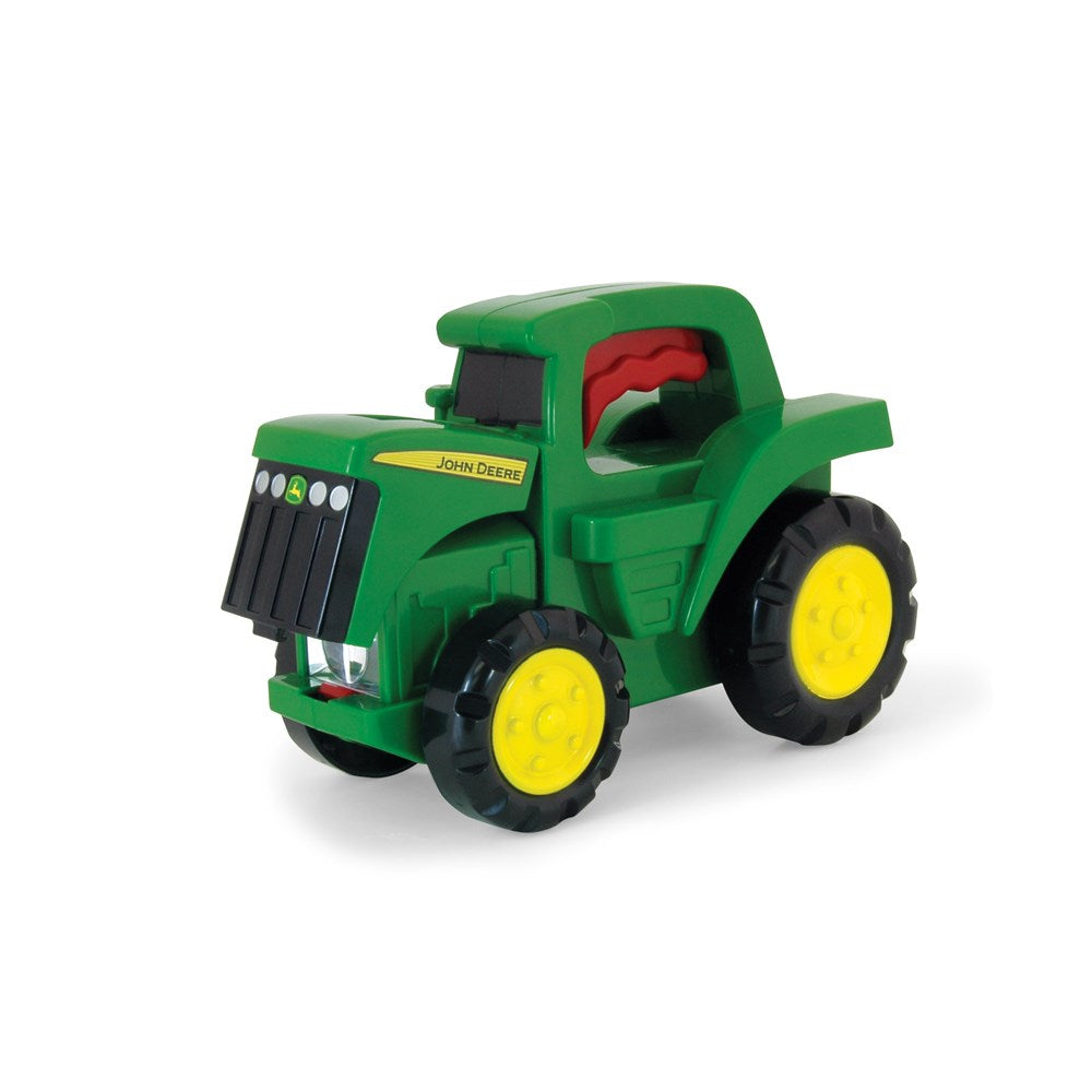 John Deere Tractor Torch . Toy tractor with yellow wheels on a white background