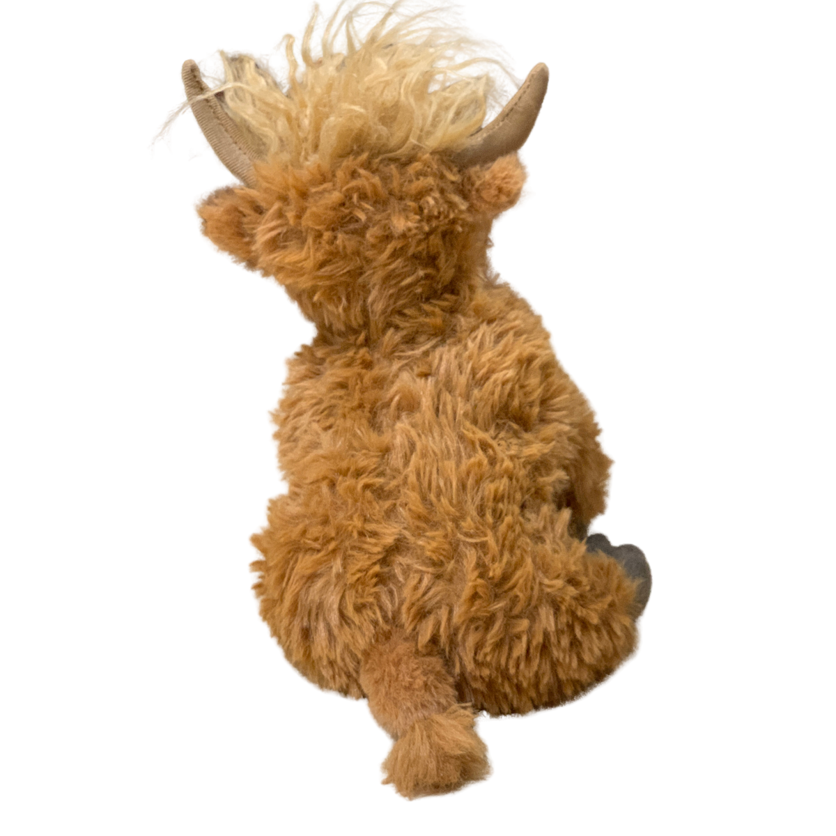 Plush toy of a brown animal with horns on a white background