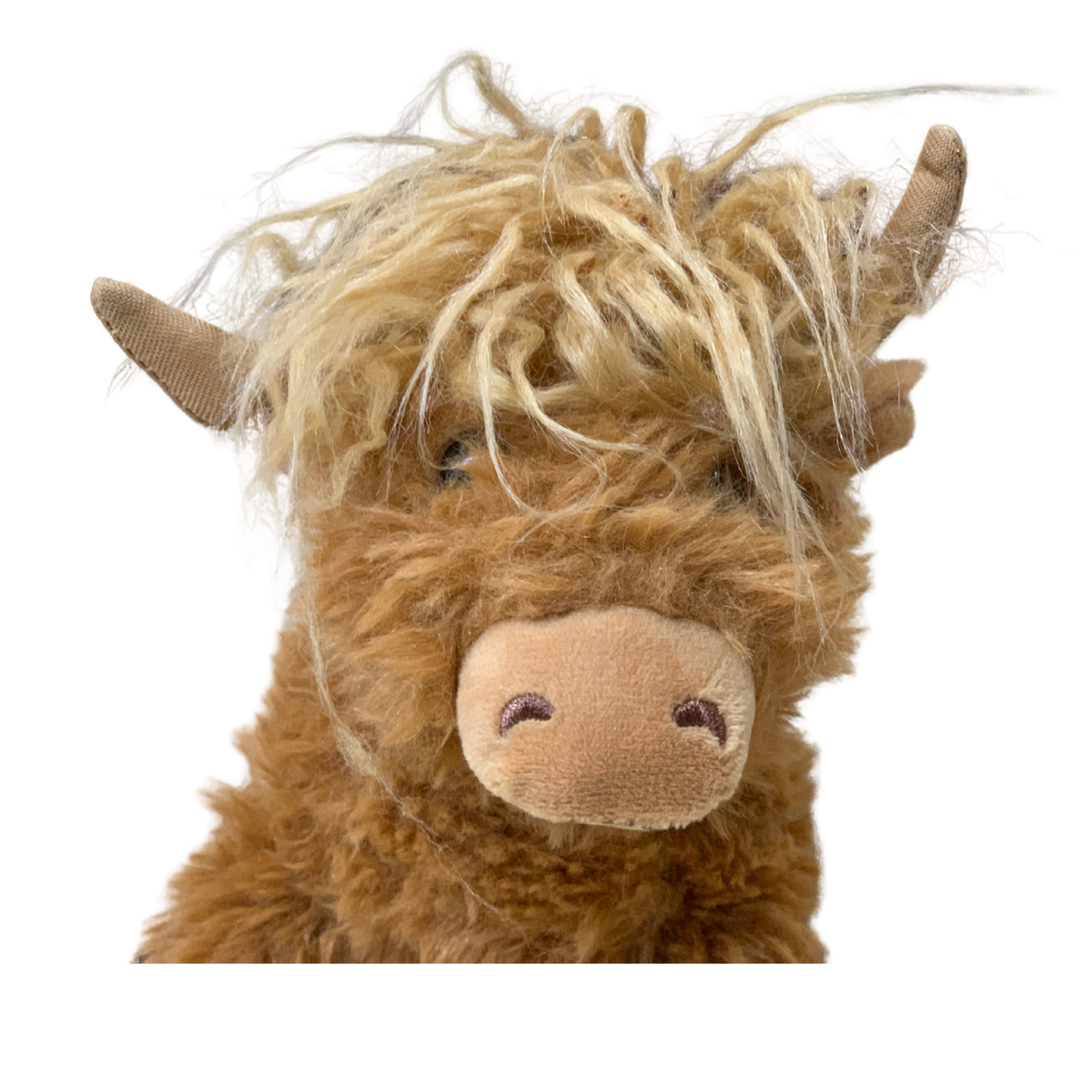 Plush toy resembling a highland cow with shaggy hair on a white background