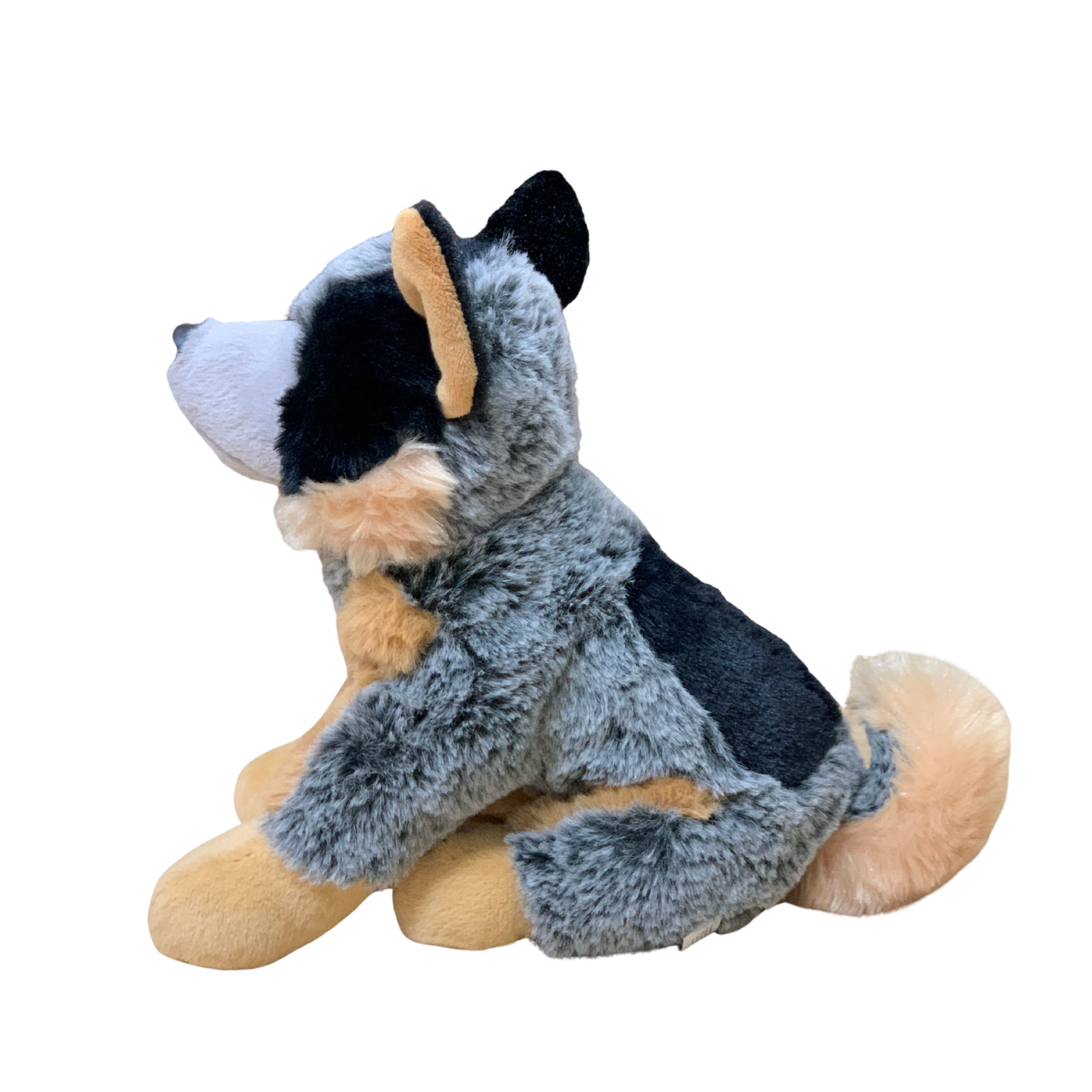 Plush toy dog with gray and black fur on a white background