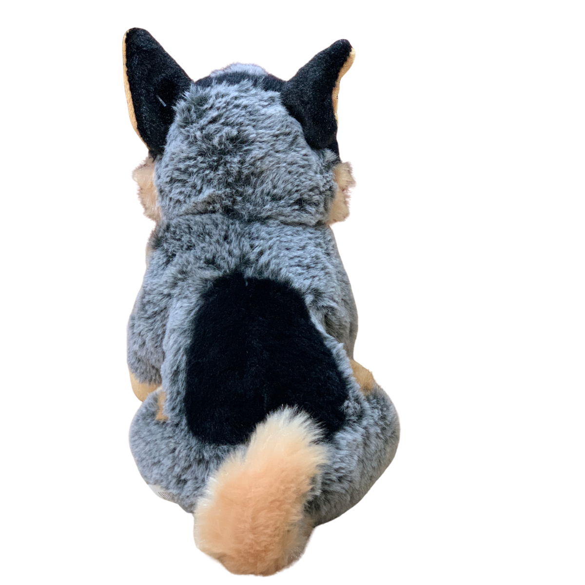 Plush toy resembling a German Shepherd dog on a white background