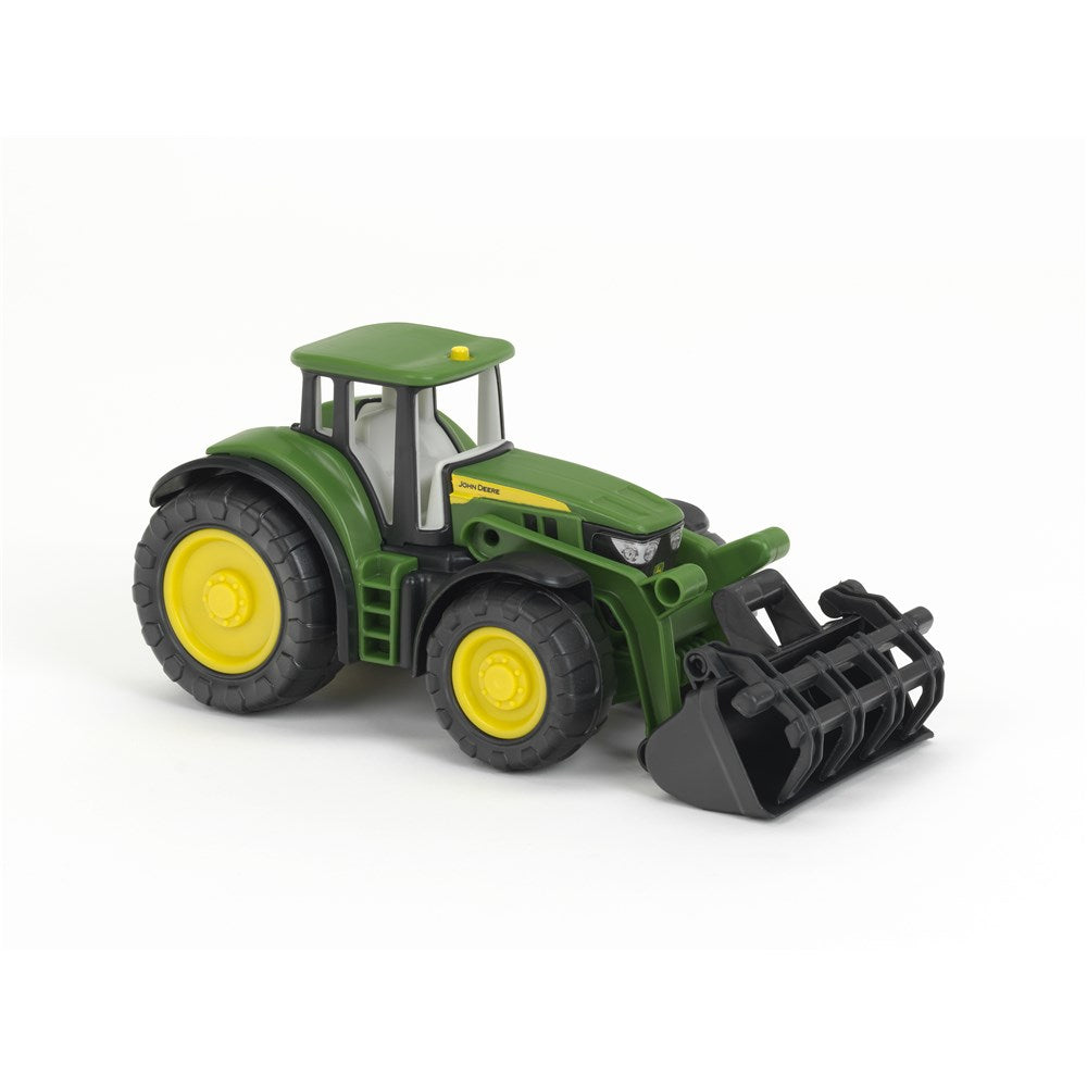 A green and yellow toy tractor with a black front loader attachment, shown on a plain white background.