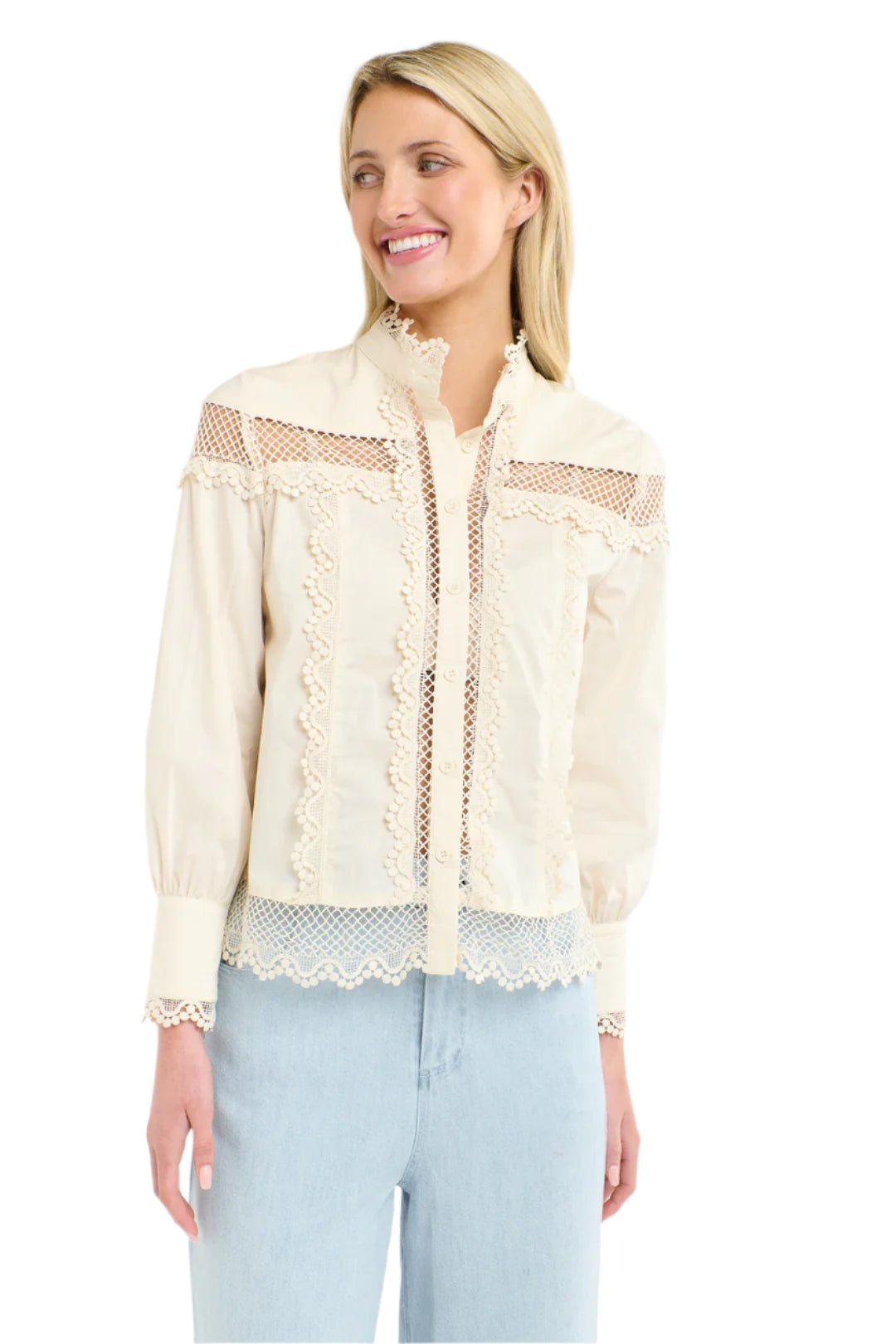 Woman wearing a 365 Women's Victoria Blouse. Vanilla lace-trimmed  with light blue jeans on a white background
