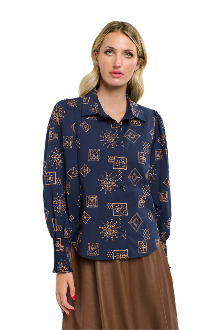 Woman wearing a 365 Women's Mandala Blouse dark blue patterned blouse with a plain background