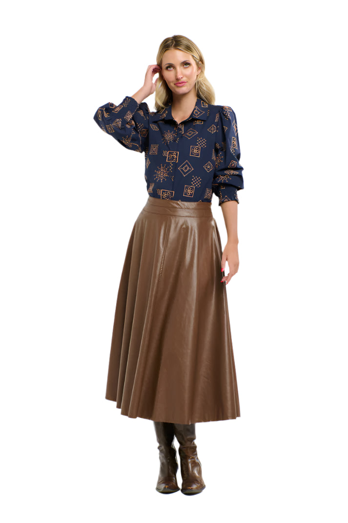 Woman wearing a 365 Women's Mandala Blouse dark blue patterned blouse with a plain background