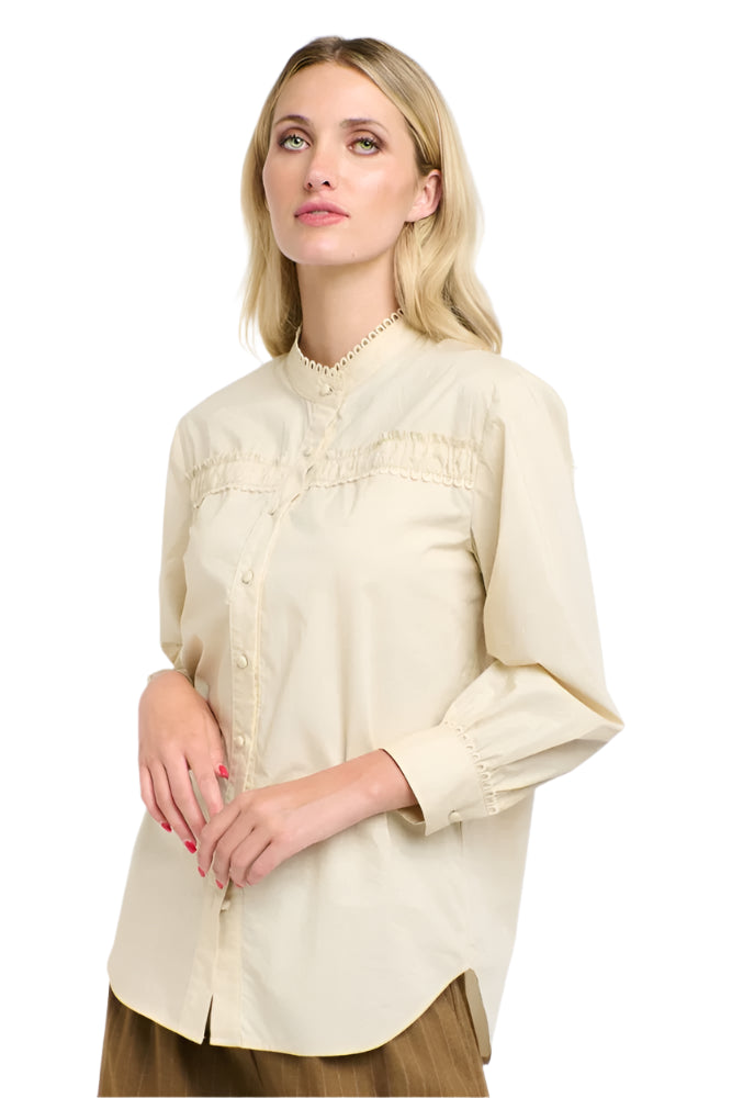Woman wearing a 365 Women's The Poet's Shirt beige blouse against a white background