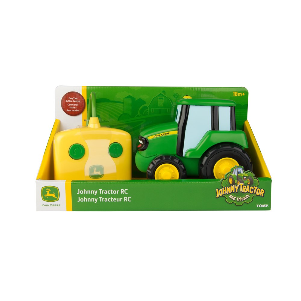 Toy tractor with packaging featuring John Deere branding on a white background
