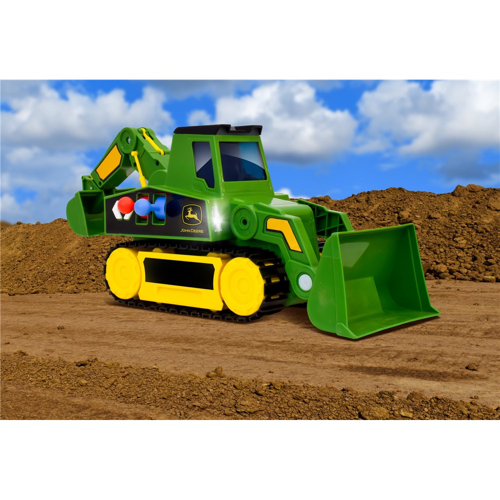 John Deere 2-in 1 Mega Excavator. Toy bulldozer with John Deere logo on a dirt field with a blue sky background