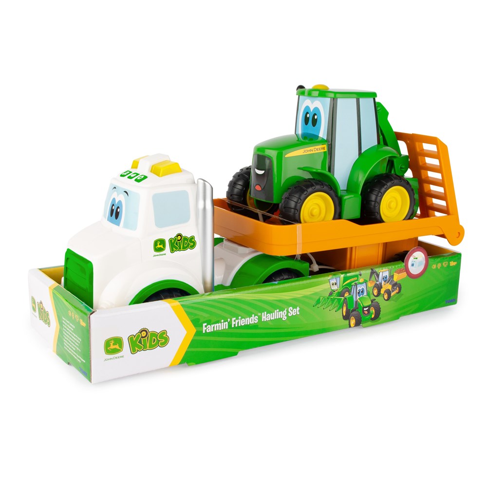 Toy truck set with a green tractor and white truck on a white background
