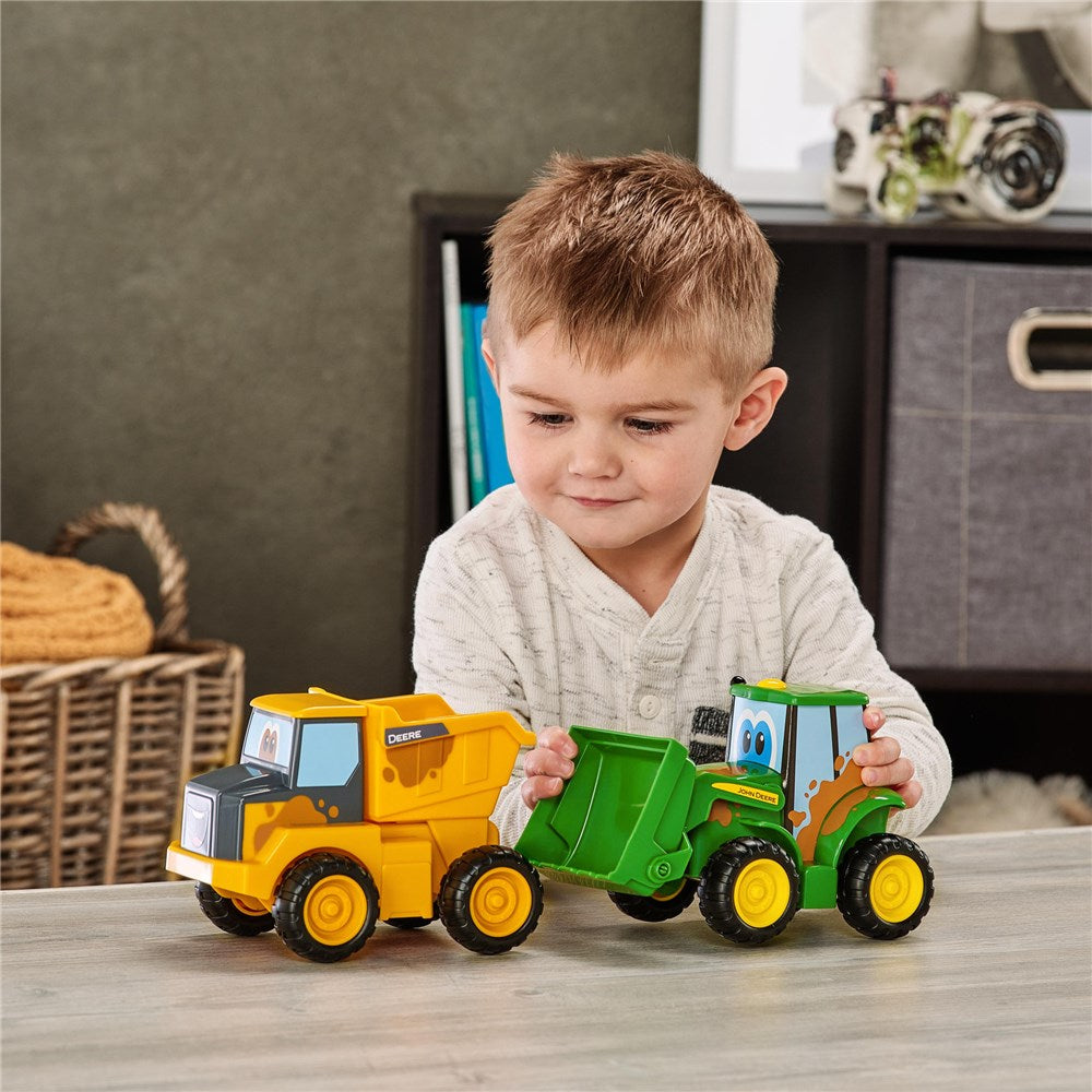 John Deere Farmin Friends Assortment. Toy dump truck and tractor set on a white background