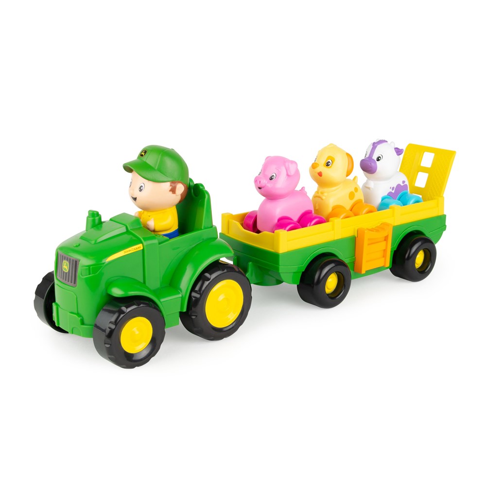 John Deere Animal Sounds Wagon Ride. Toy tractor with a driver figure and colorful animals in a trailer on a white background