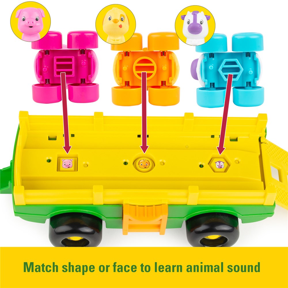 John Deere Animal Sounds Wagon Ride. Toy tractor with a driver figure and colorful animals in a trailer on a white background